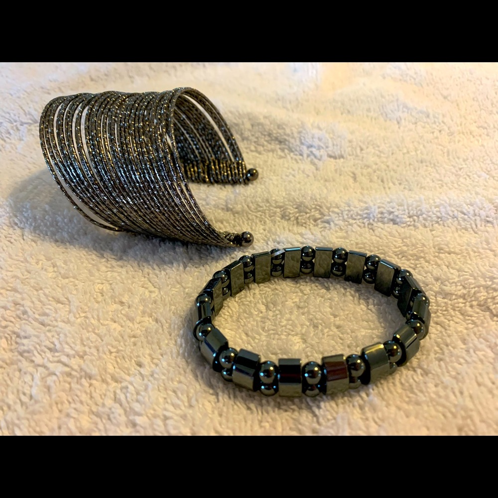 Cuff bracelet and stretchy bracelet.